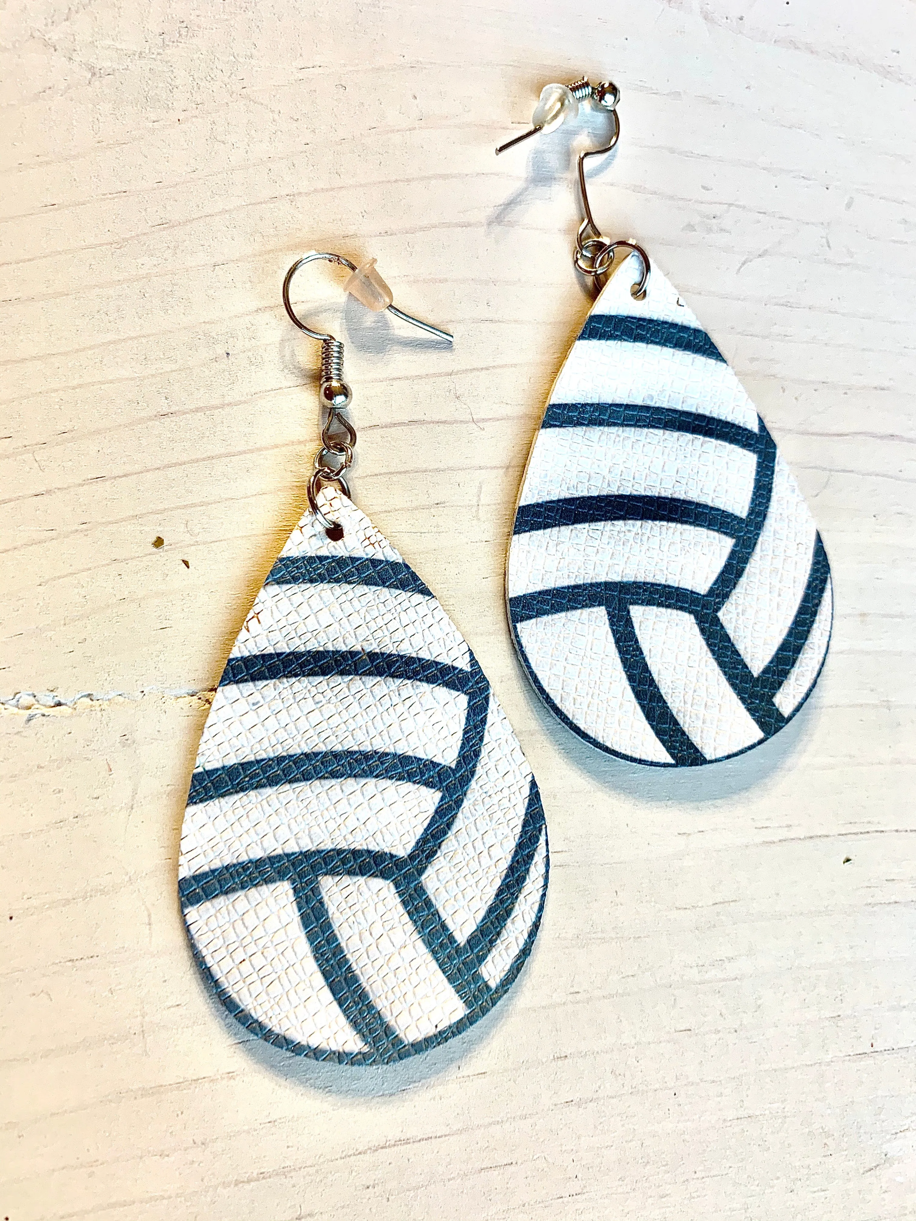 Earrings { Leather } Football. Buffalo plaid. Glitter. Basketball. Baseball. Volleyball. Paisley. Floral. Leopard. Rainbow. Giraffe. $5 jewelry!