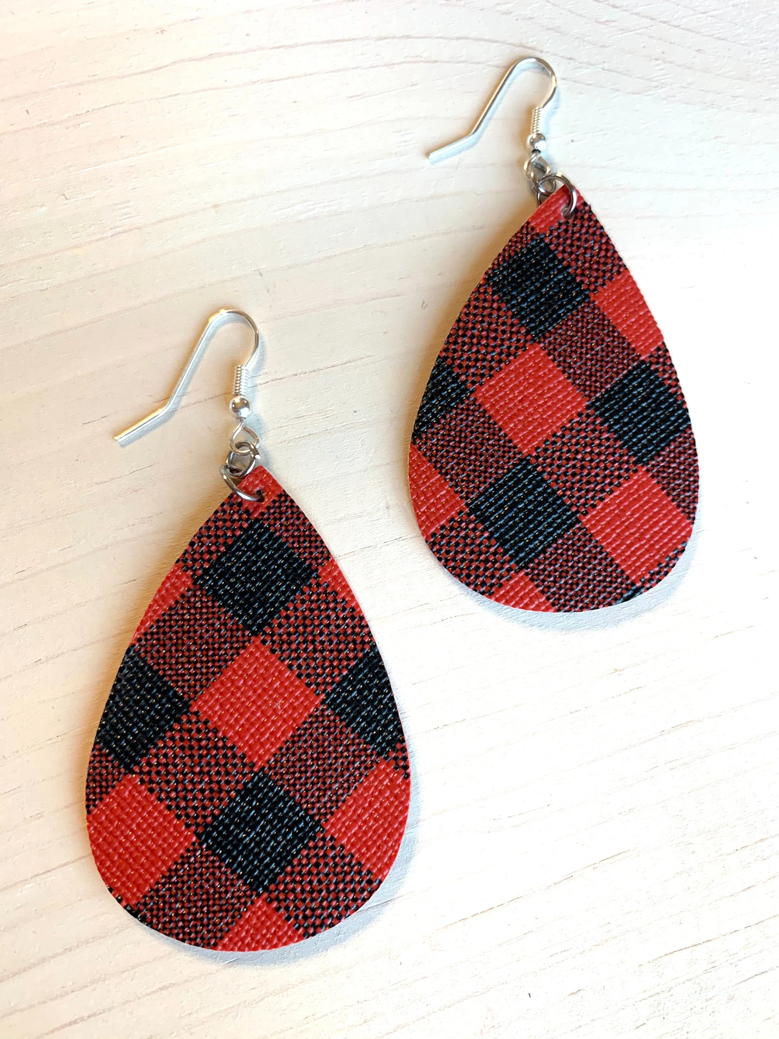 Earrings { Leather } Football. Buffalo plaid. Glitter. Basketball. Baseball. Volleyball. Paisley. Floral. Leopard. Rainbow. Giraffe. $5 jewelry!