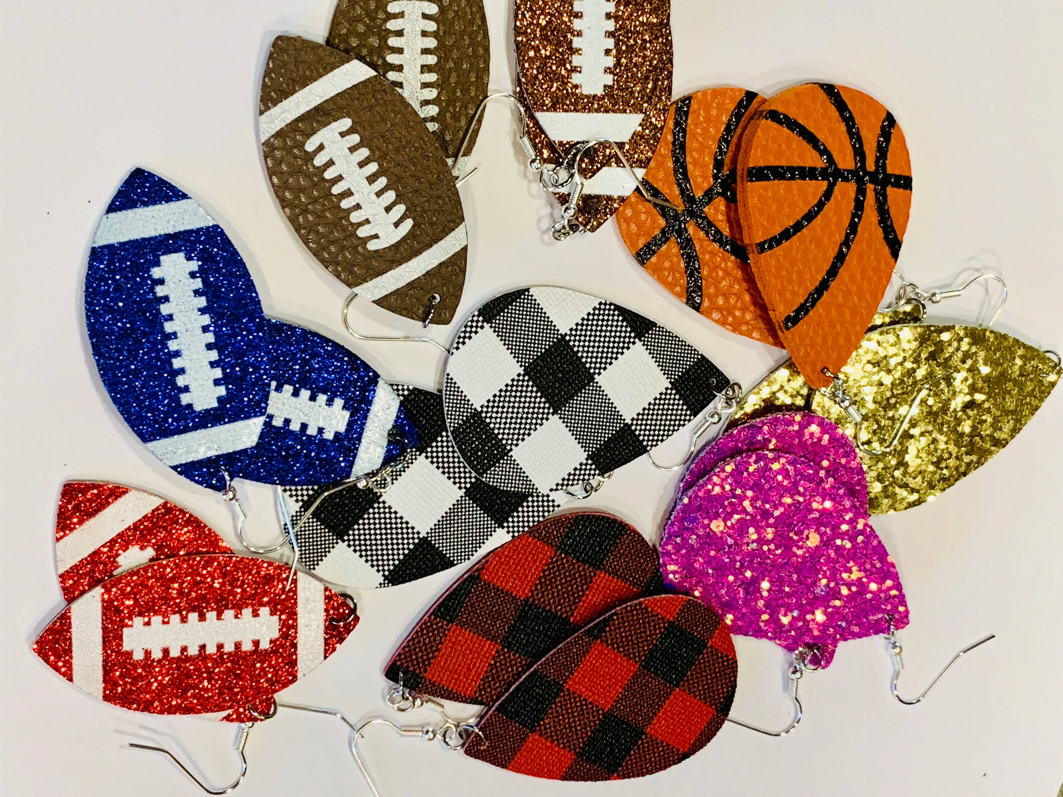 Earrings { Leather } Football. Buffalo plaid. Glitter. Basketball. Baseball. Volleyball. Paisley. Floral. Leopard. Rainbow. Giraffe. $5 jewelry!