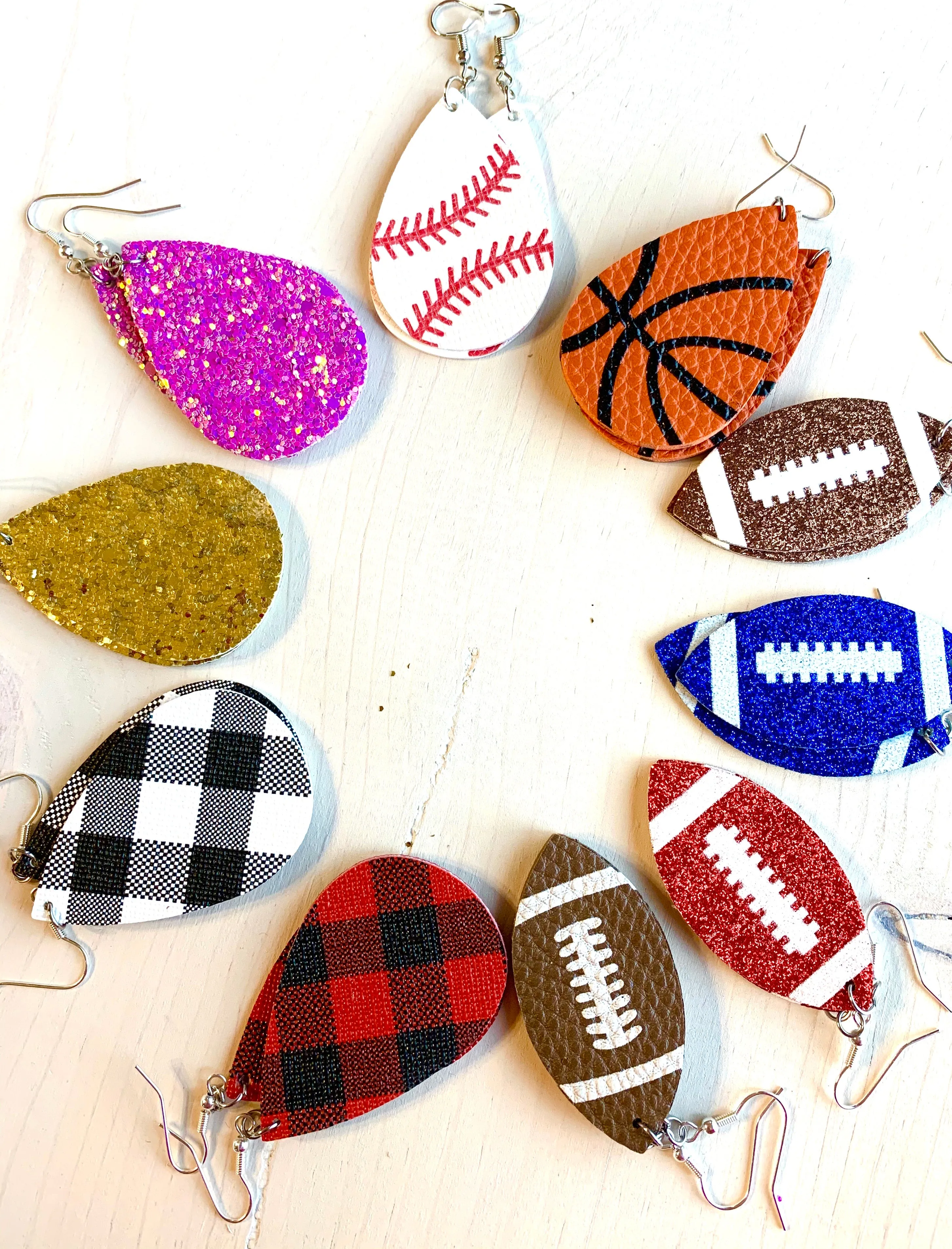 Earrings { Leather } Football. Buffalo plaid. Glitter. Basketball. Baseball. Volleyball. Paisley. Floral. Leopard. Rainbow. Giraffe. $5 jewelry!