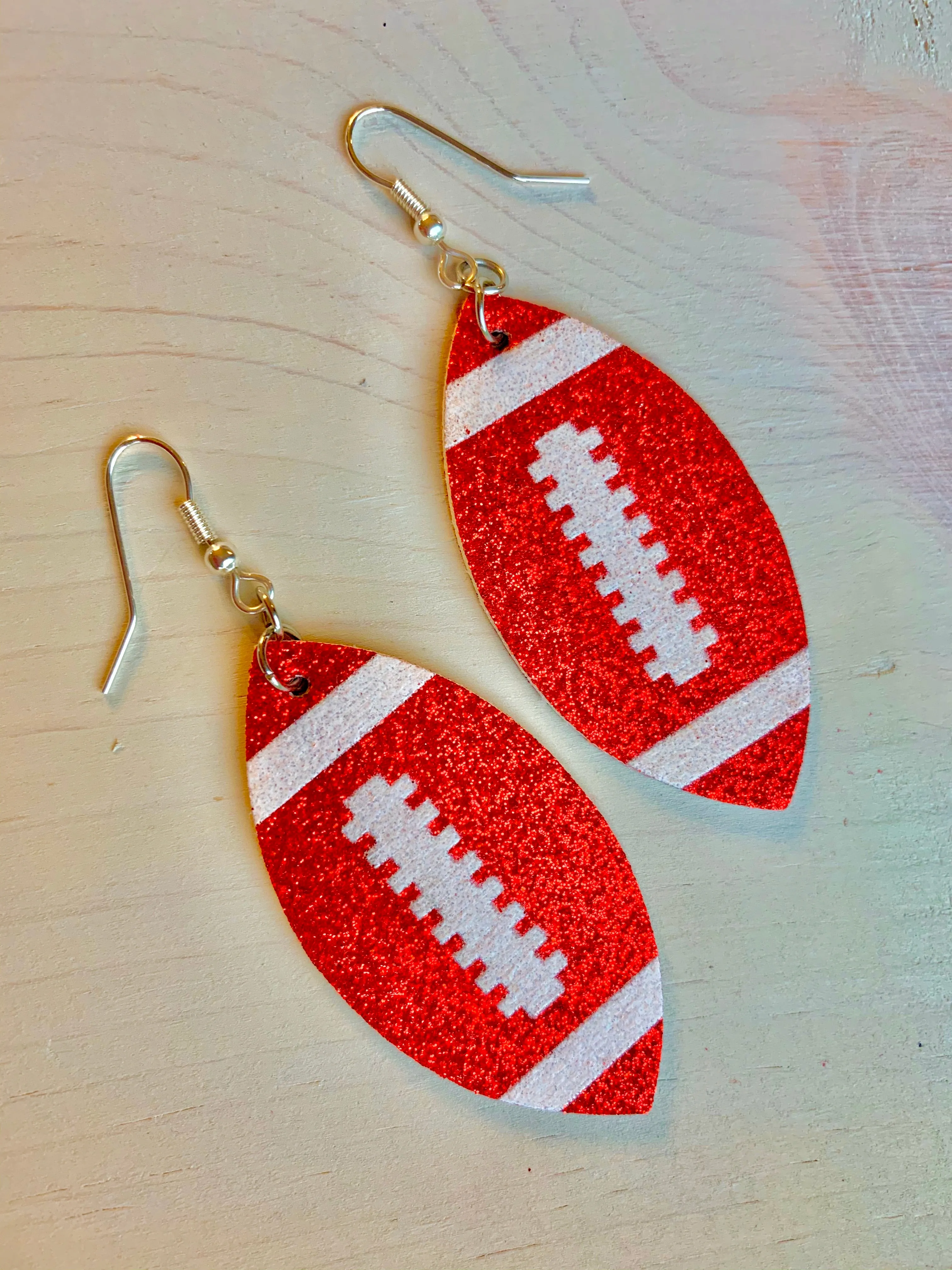 Earrings { Leather } Football. Buffalo plaid. Glitter. Basketball. Baseball. Volleyball. Paisley. Floral. Leopard. Rainbow. Giraffe. $5 jewelry!