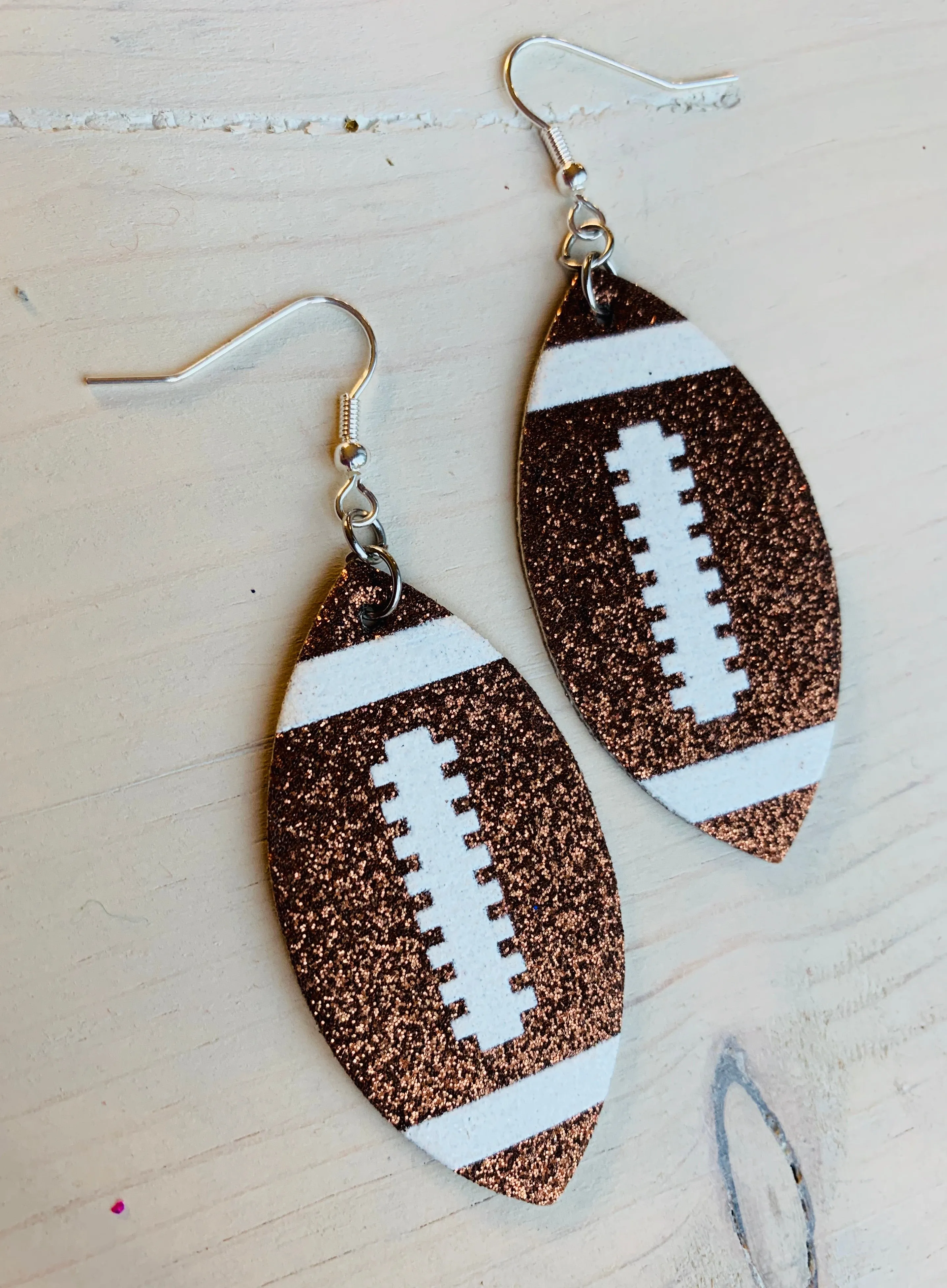 Earrings { Leather } Football. Buffalo plaid. Glitter. Basketball. Baseball. Volleyball. Paisley. Floral. Leopard. Rainbow. Giraffe. $5 jewelry!